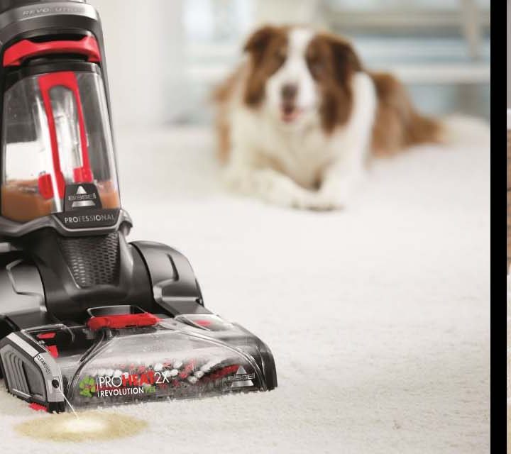 The BISSELL ProHeat 2X Revolution Pet Pro being used on carpet floor and stairs.