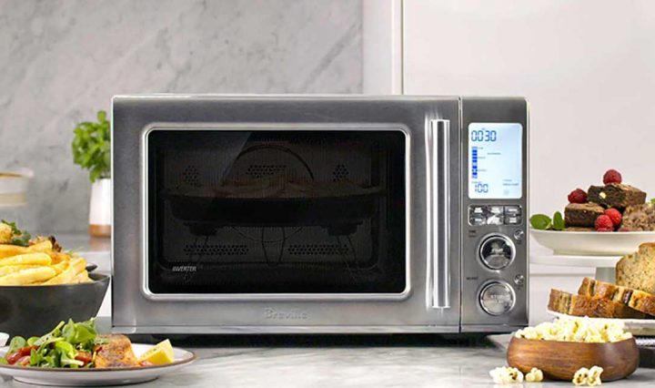 Breville the Combi Wave 3 in 1 surrounded by food.