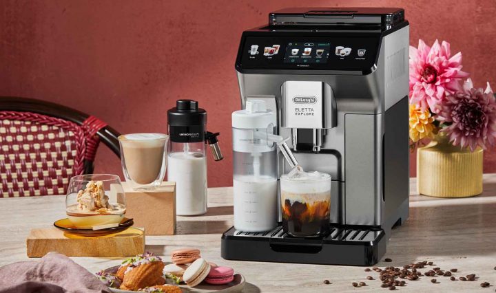 Coffee-Infused Madeleines + Macadamia Affogato recipes in front of the De'Longhi Eletta Explore Coffee Machine.