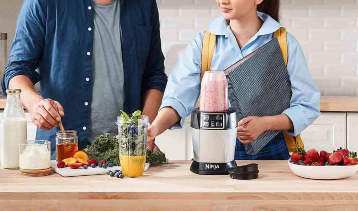 The Nutri Ninja Auto IQ Blender being used to make a Dairy-Free Berry Bliss Smoothie recipe.