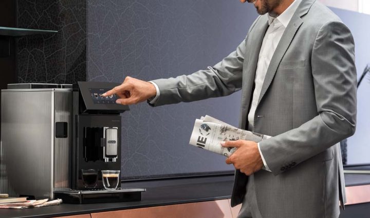 Man operating the De'Longhi Maestosa Coffee Machine.