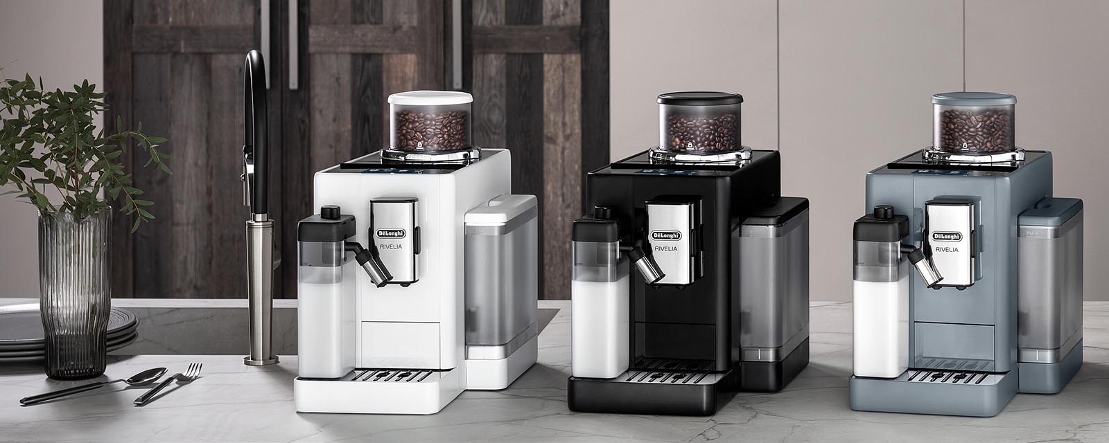 Three De'Longhi Rivelia Coffee Machines next to each other.