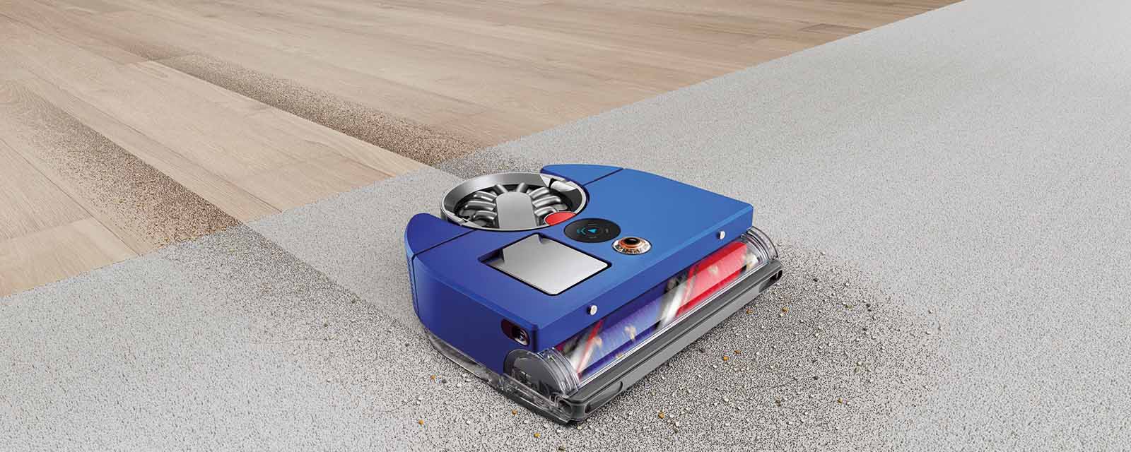 The Dyson 360 Vis Nav Robot Vacuum cleaning dirt off the floor.