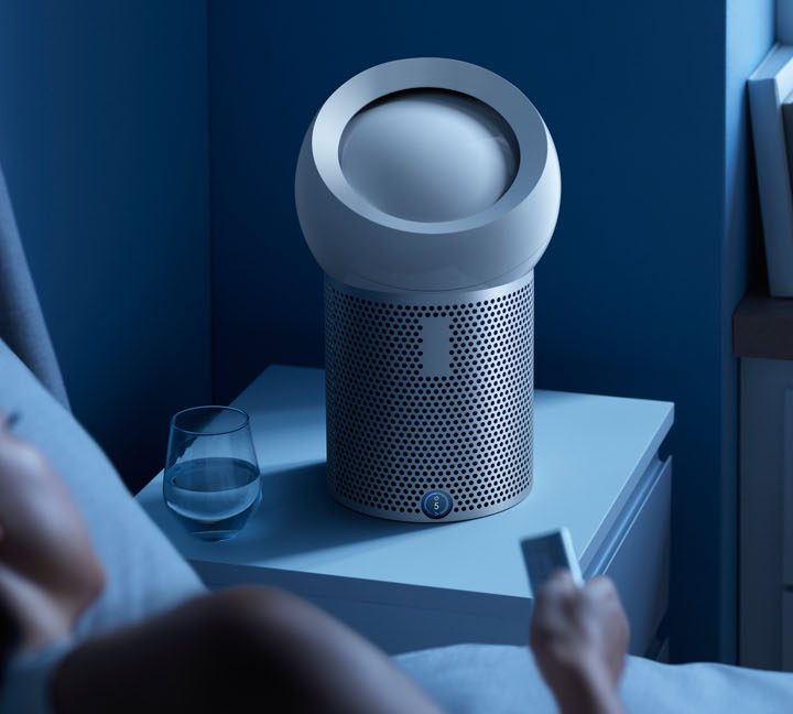 Dyson Pure Cool Me personal purifying fan next to bed.