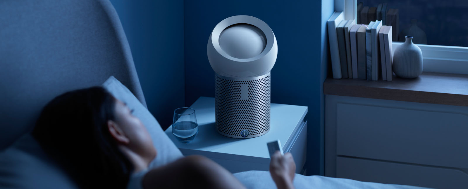 Dyson Pure Cool Me personal purifying fan next to bed.