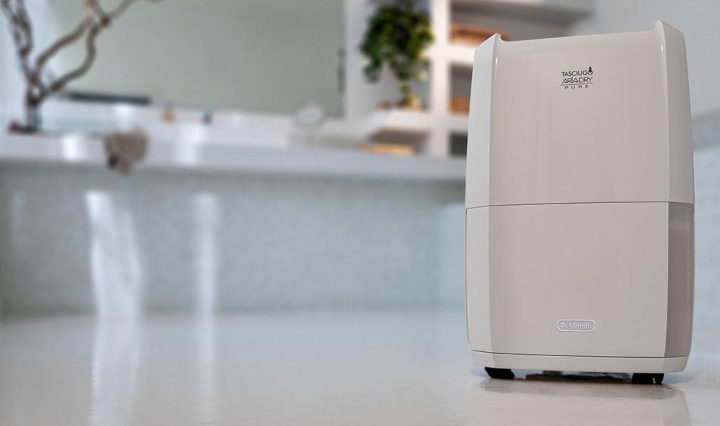 DeLonghi Tasciugo AriaDry Pure 2-in-1 Dehumidifier & Air Purifier in a bathroom.