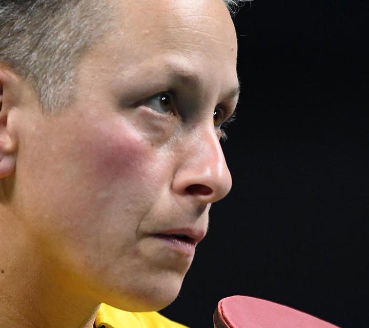Paralympian Danni Di Toro with table tennis bat in hand.