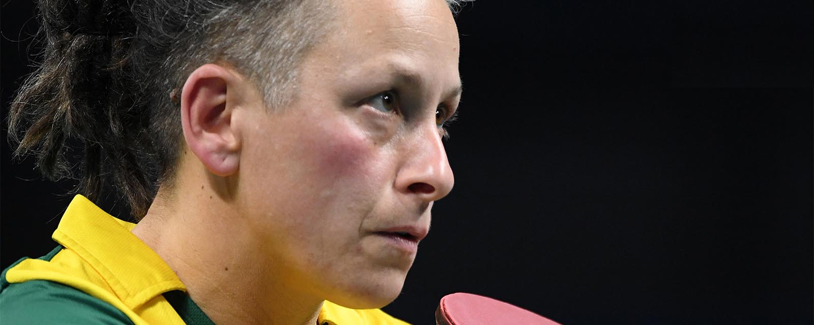 Paralympian Danni Di Toro with table tennis bat in hand.