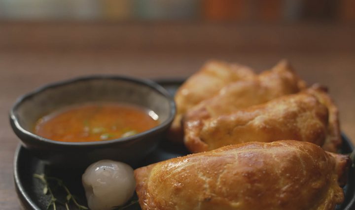 Quail + Nduja Empanadas on a plate.