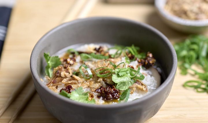Mushroom Congee and chop sticks.