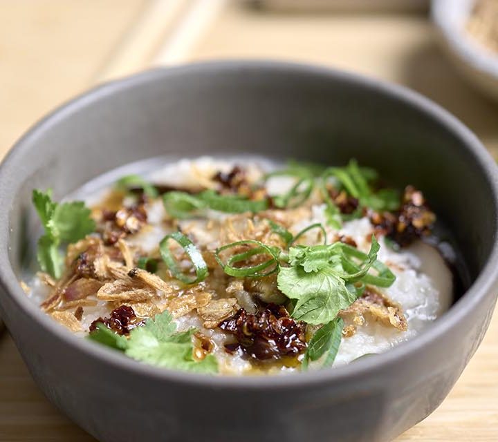 Mushroom Congee and chop sticks.