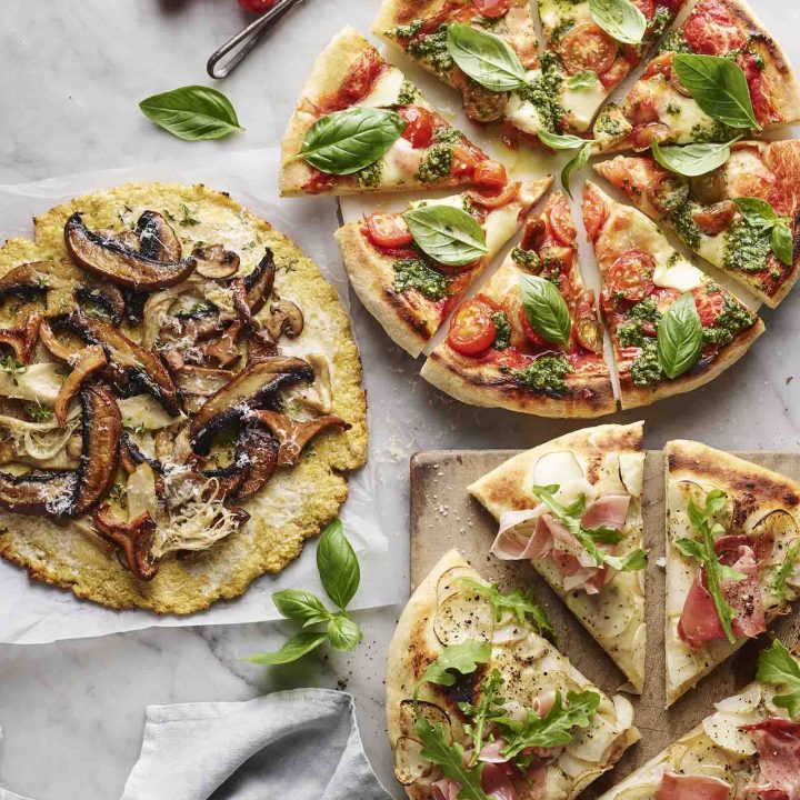 Three pizzas with cauliflower bases.