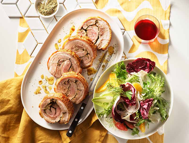 Native spiced porchetta with bitter leaf salad, citrus and herbs.