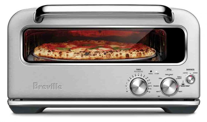 The Smart Oven Pizzaiolo by Breville surrounded by pizzas!