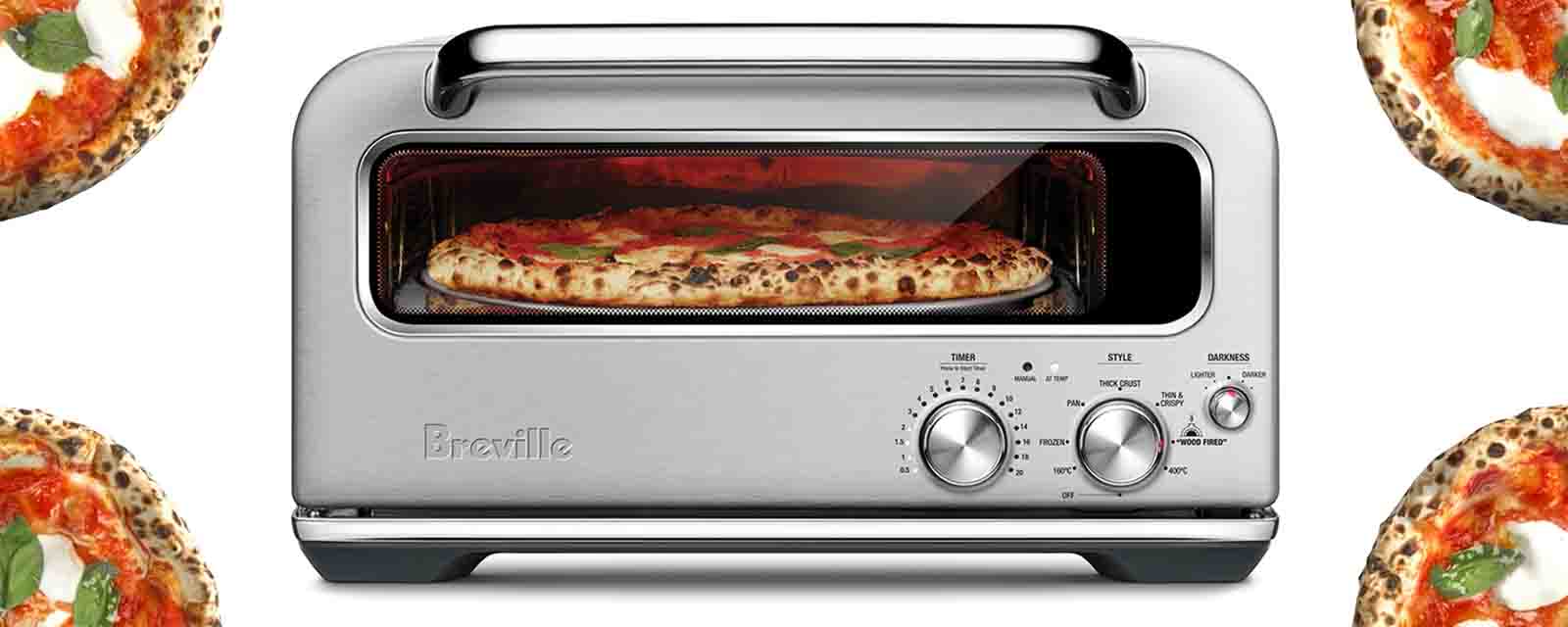 The Smart Oven Pizzaiolo by Breville surrounded by pizzas!