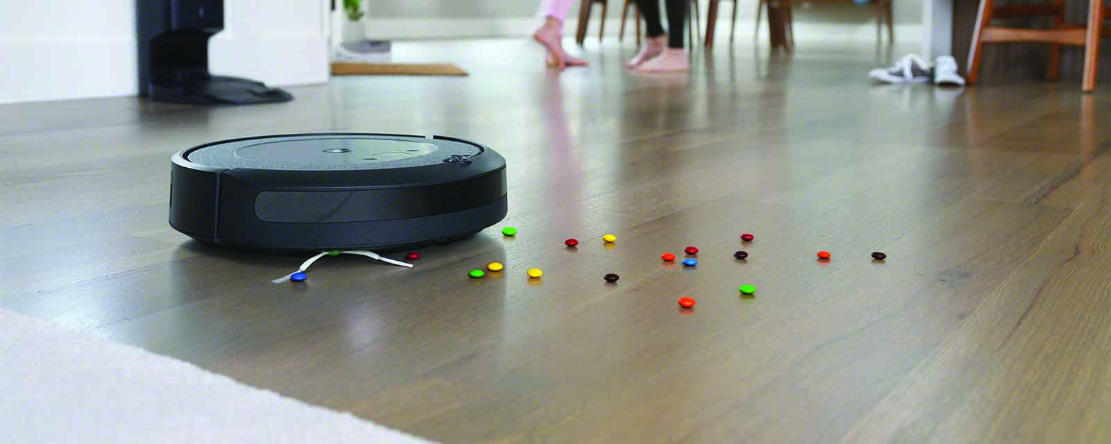 iRobot Roomba i3+ Robotic Vacuum cleaning smarties off the floor.