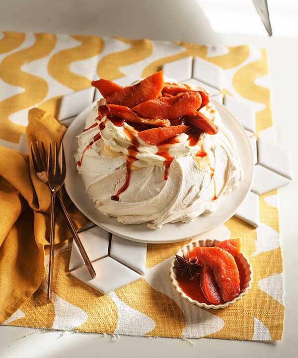Pavlova with wattleseed crème patisserie, cream and poached quince.