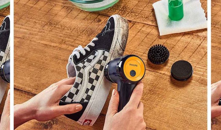 The Philips Sneaker Cleaner being used to clean a canvas shoe.
