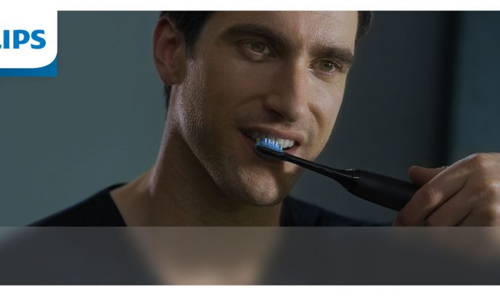 A man using the Philips Sonicare DiamondClean 9000 Electric Toothbrush.