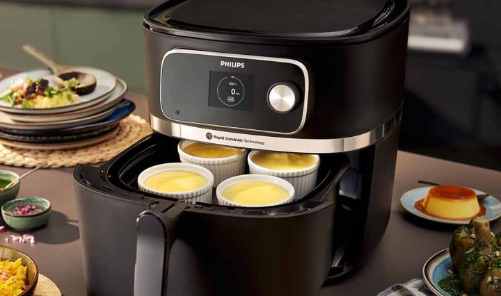 A whole feast of food that has been cooked in the Philips 7000 XXXL Airfryer.