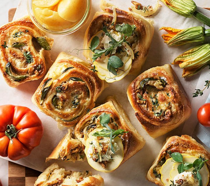 Brioche Scrolls on a kitchen bench.
