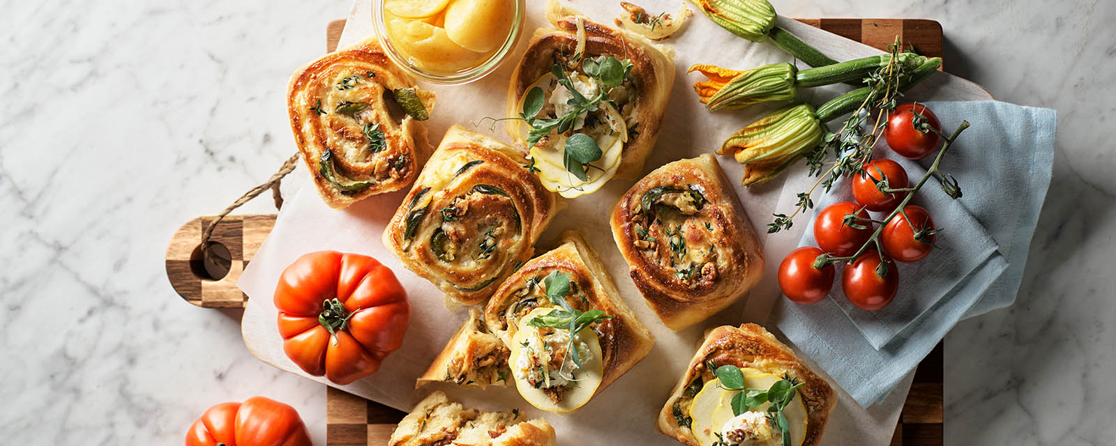 Brioche Scrolls on a kitchen bench.