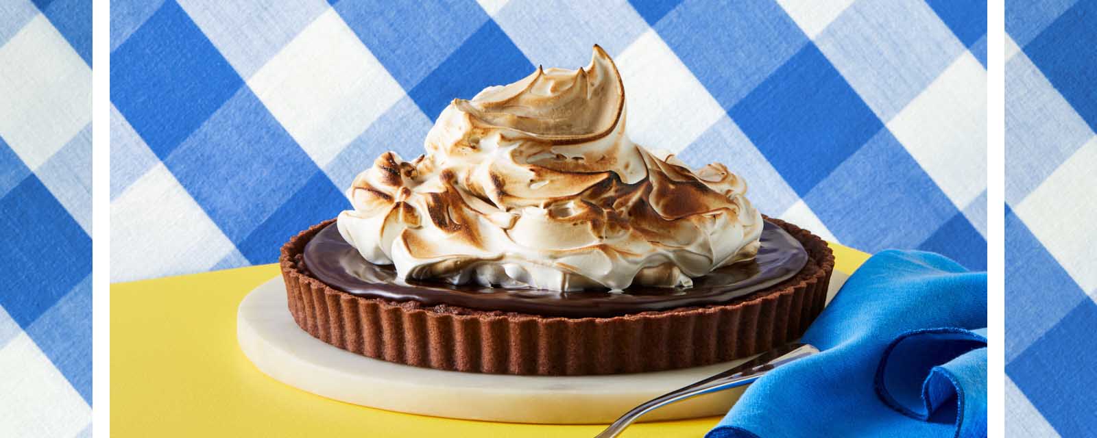 Chocolate Almond Tart with a blue napkin.