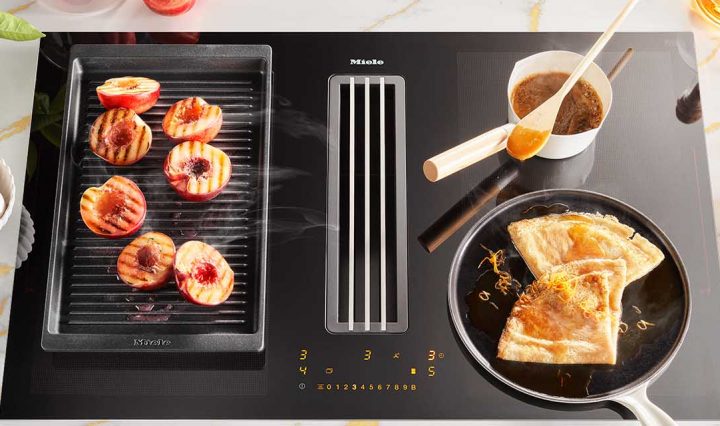 Orange Crepe Suzette being cooked on a Miele 800mm 4 Zone Induction Cooktop with Vapour Extraction.