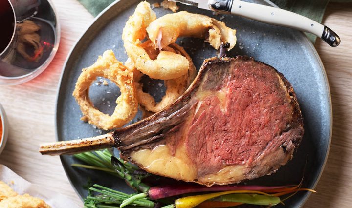 Rib Roast and Fried Onion Rings on a plate.