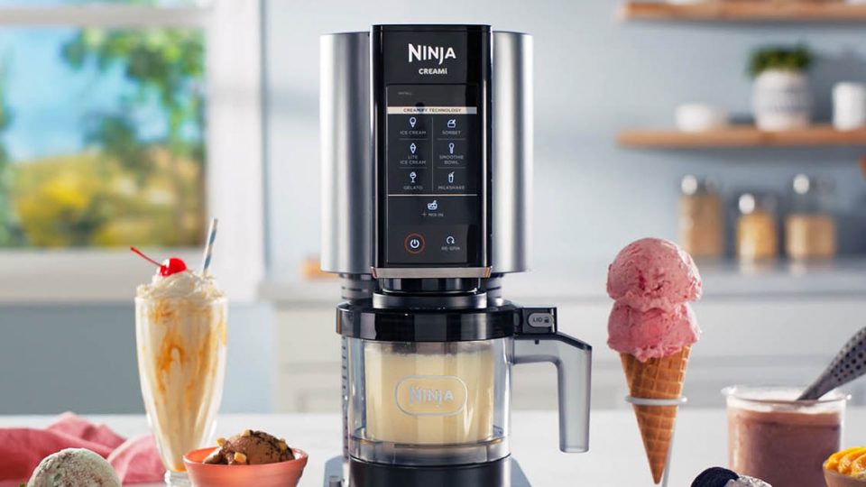 The Ninja Creami Ice Cream Maker next to an ice cream cone and milkshake.