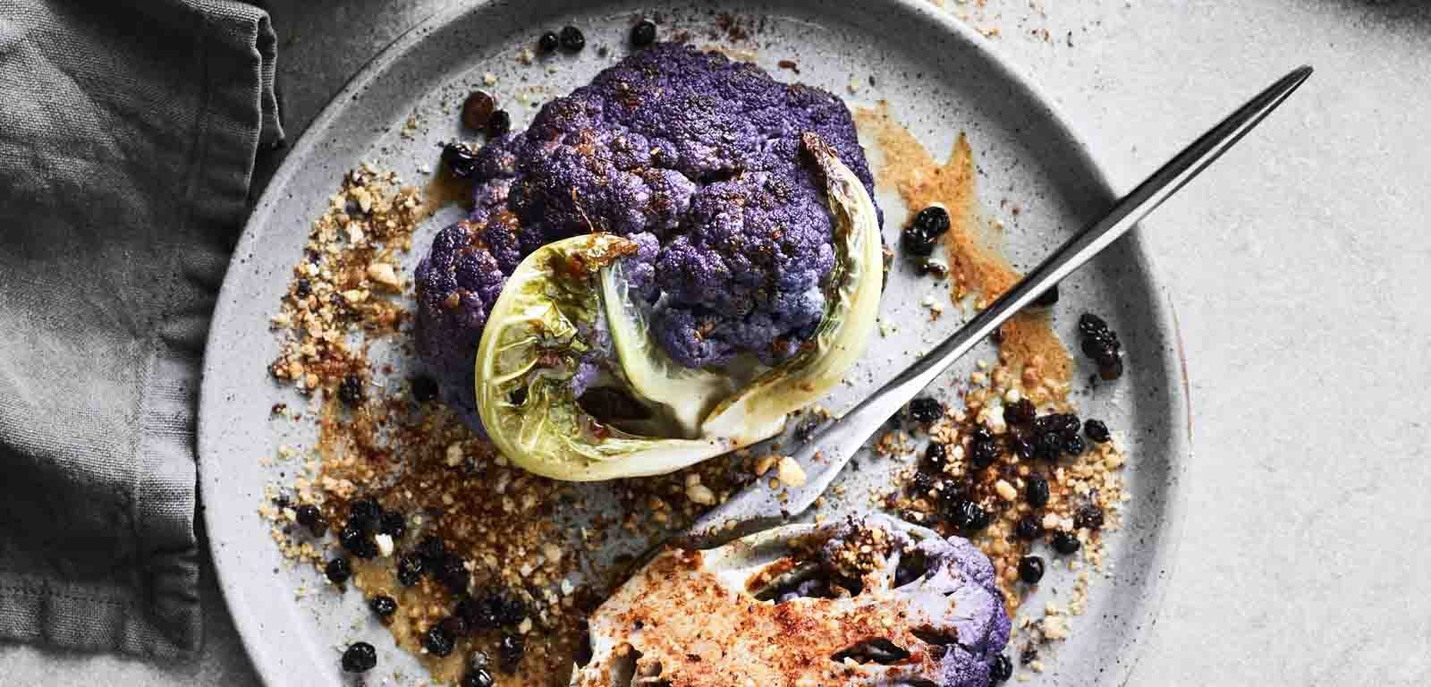 Roasted Purple Cauliflower with Harissa, Macadamia and Pickled Currants