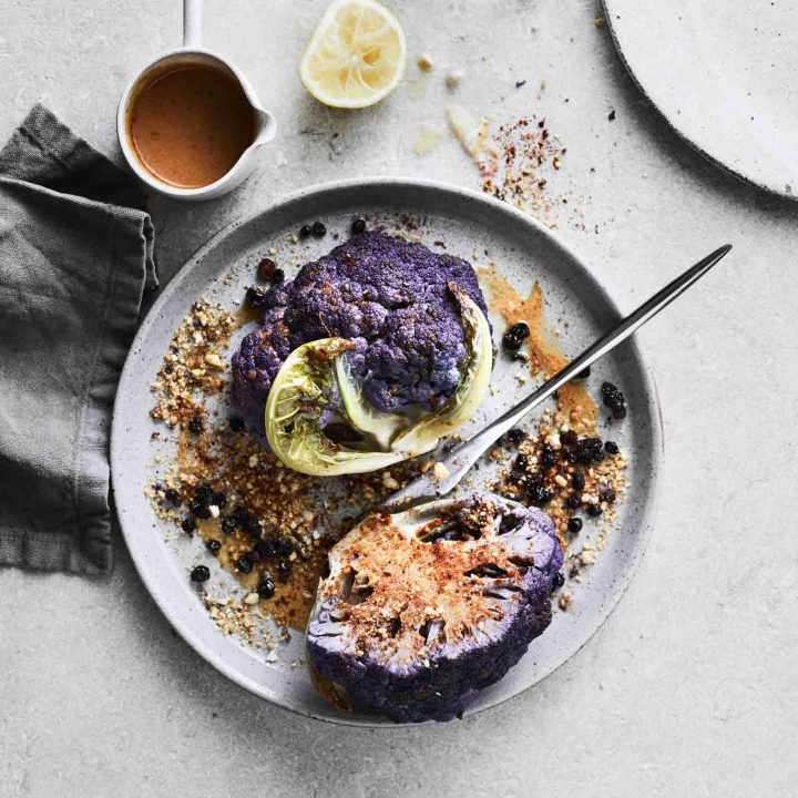 Roasted Purple Cauliflower with Harissa, Macadamia and Pickled Currants