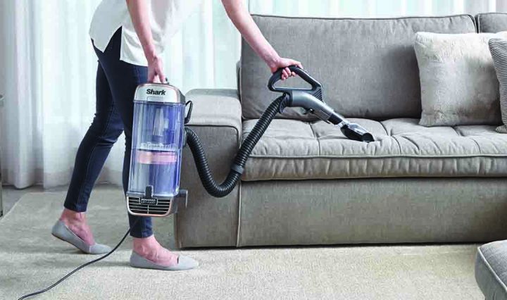Cleaning a lounge with the Shark PZ1000 Vacuum Cleaner.